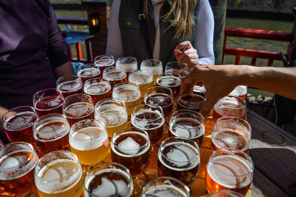 A group of friends playing a beer tasting contest.