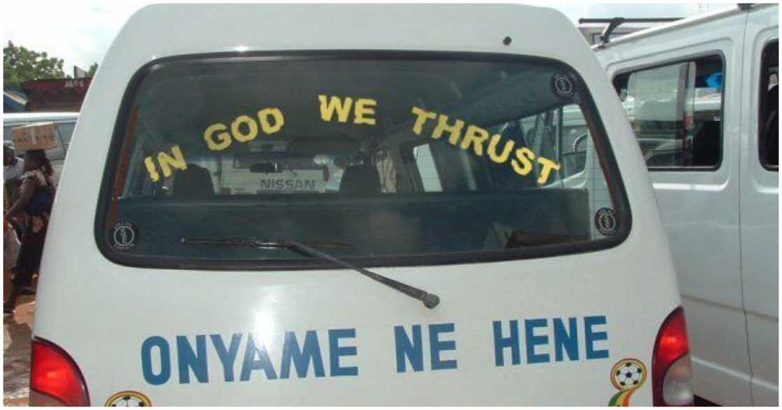 "In God we thrust" written behind a trotro "In God we thrust" written behind a trotro