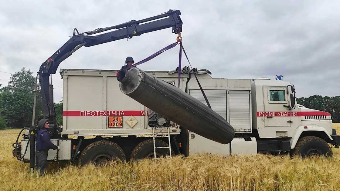 A crane lifts part of an unexploded missile from a a wheat field in UKraine's Mykolaiv region, as a deal is due to be signed tounblock grain exports A crane lifts part of an unexploded missile from a a wheat field in UKraine's Mykolaiv region, as a deal is due to be signed tounblock grain exports