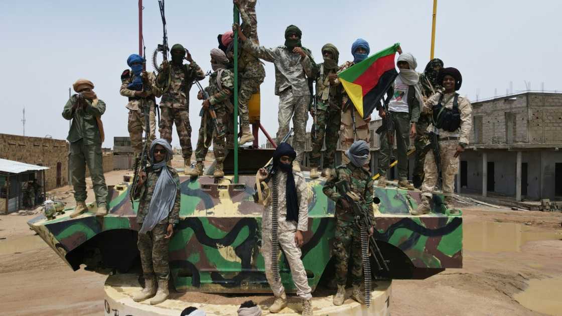 Fighters from the National Movement for the Liberation of Azawad (MNLA), part of the CMA alliance, pose for a picture during the August talks Fighters from the National Movement for the Liberation of Azawad (MNLA), part of the CMA alliance, pose for a picture during the August talks