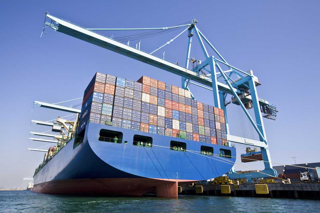 A boat carrying cargo with cranes