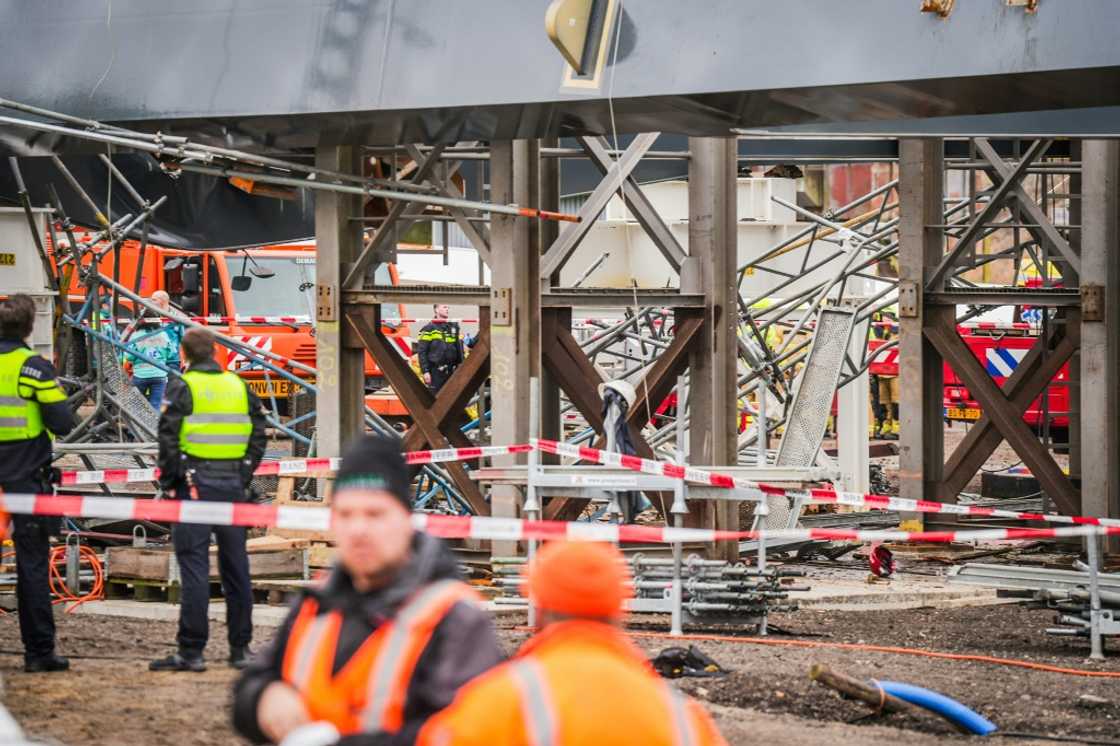 A local reporter at the scene said workmen had been hoisting bridge arches when the accident happened A local reporter at the scene said workmen had been hoisting bridge arches when the accident happened