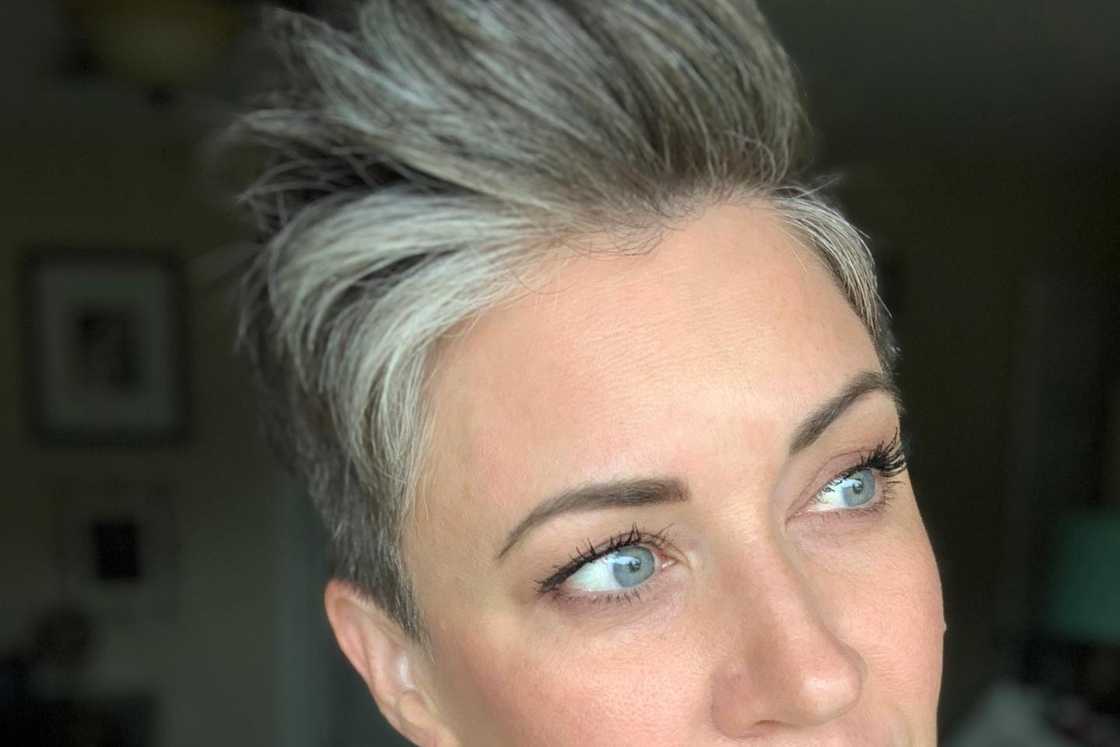 A woman rocks a medium-length layered grey pompadour A woman rocks a medium-length layered grey pompadour