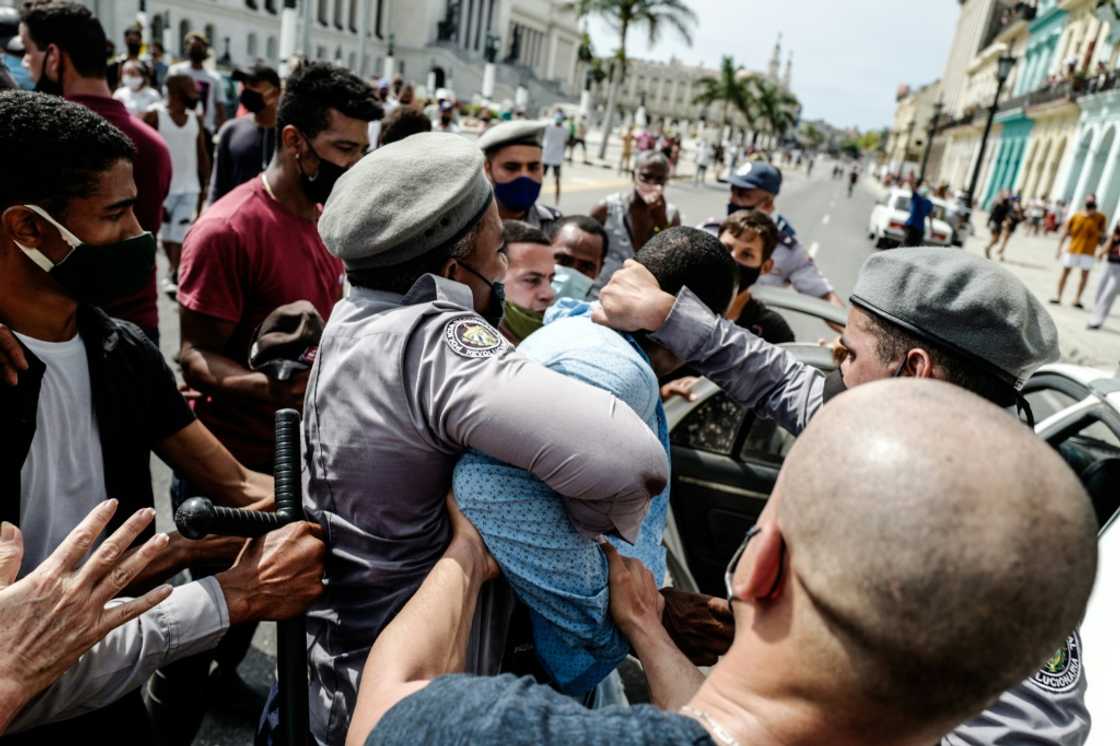 Cuban police detain an anti-government protester in this file photo from July 11, 2021 Cuban police detain an anti-government protester in this file photo from July 11, 2021