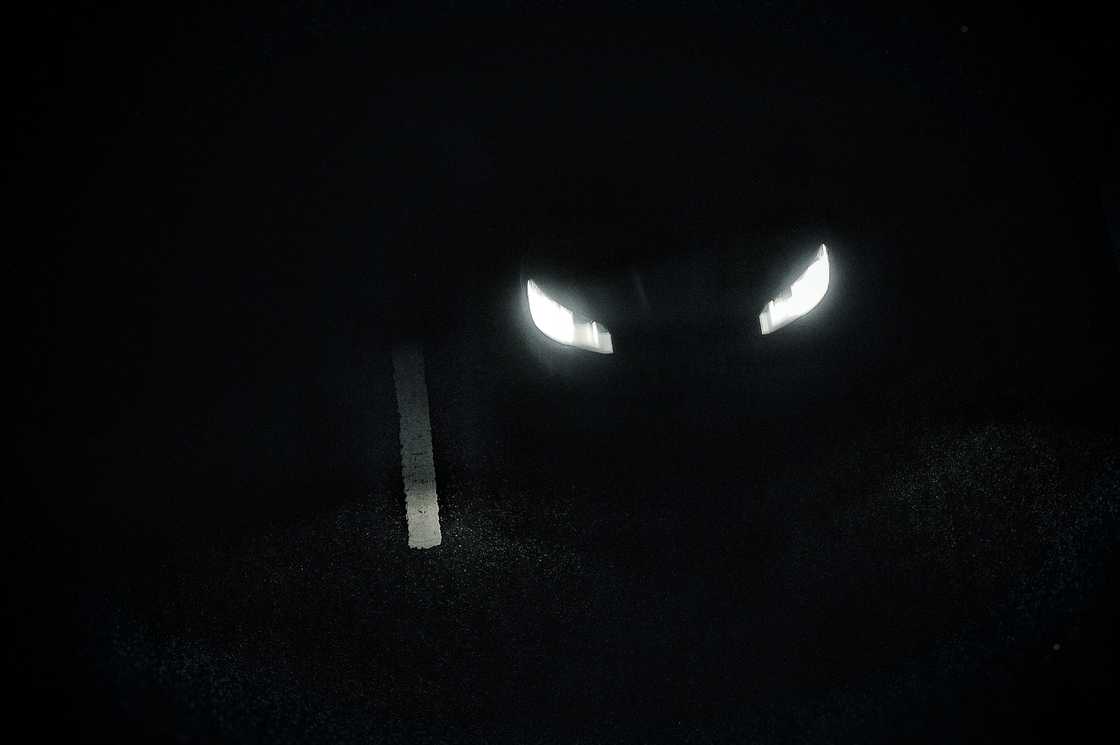 A faint glow of buried headlights in the dark. A faint glow of buried headlights in the dark.