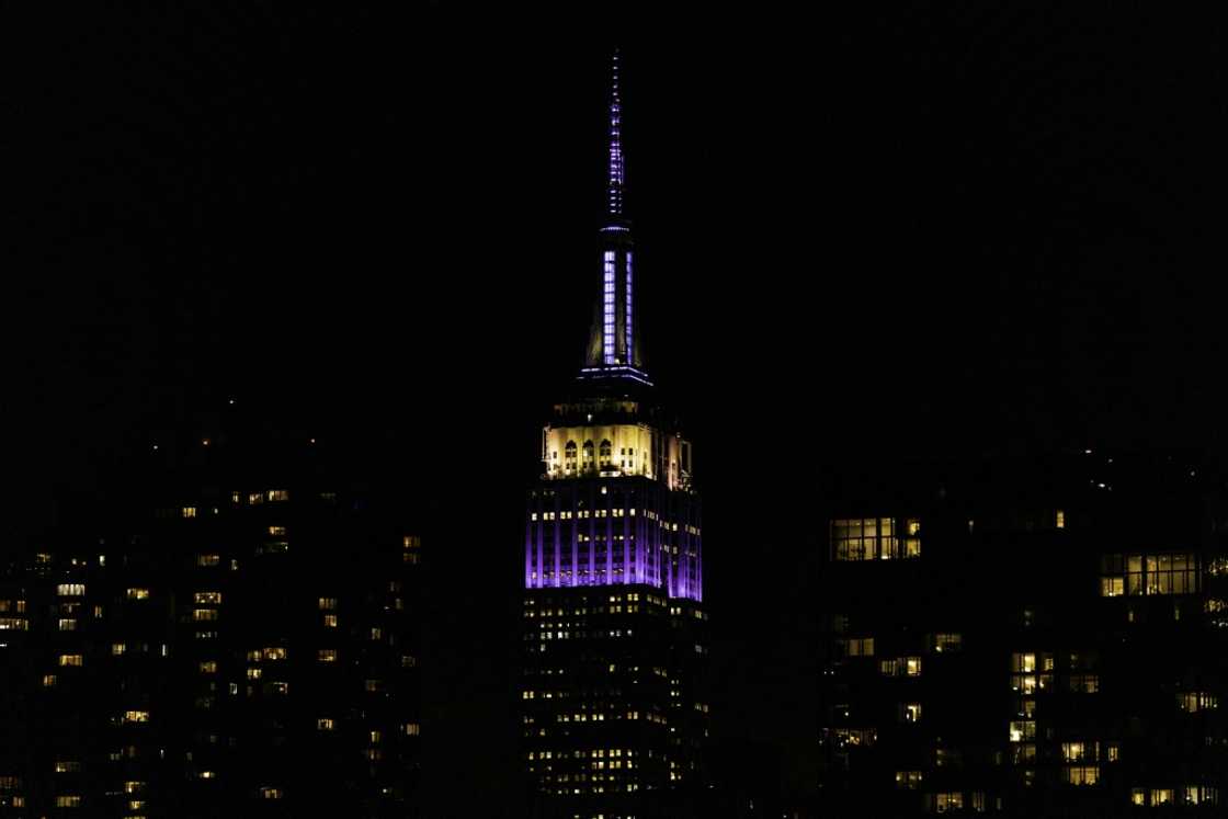 The Empire State Building is lit in purple and silver to celebrate of the 'life and legacy' of the late Queen Elizabeth II The Empire State Building is lit in purple and silver to celebrate of the 'life and legacy' of the late Queen Elizabeth II