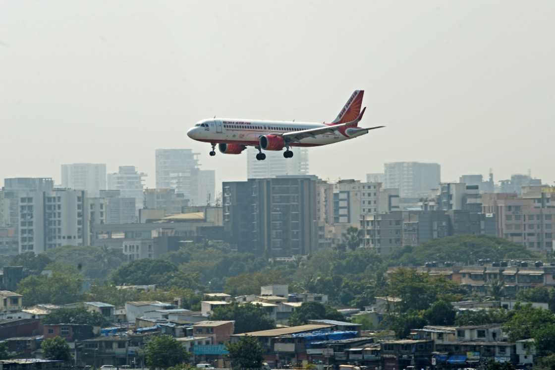 Wells Fargo on Friday sacked a top Indian executive now being pursued by police for allegedly urinating on a fellow passenger aboard an Air India flight