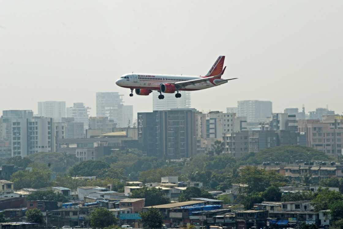 Wells Fargo on Friday sacked a top Indian executive now being pursued by police for allegedly urinating on a fellow passenger aboard an Air India flight Wells Fargo on Friday sacked a top Indian executive now being pursued by police for allegedly urinating on a fellow passenger aboard an Air India flight