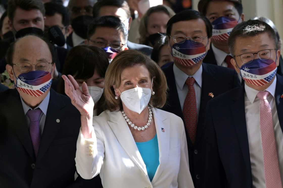 US House Speaker Nancy Pelosi waves to journalists during her arrival at the parliament in Taipei on August 3, 2022 US House Speaker Nancy Pelosi waves to journalists during her arrival at the parliament in Taipei on August 3, 2022
