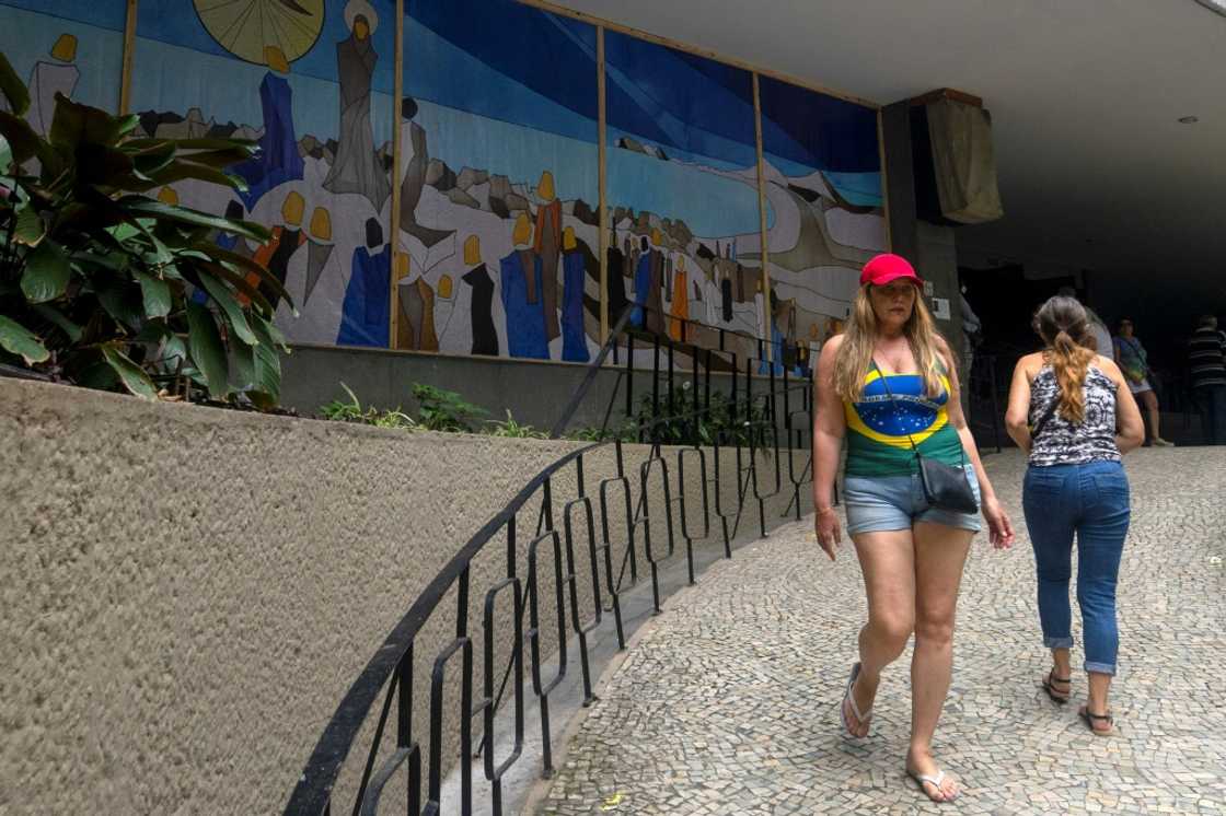 A woman leaves Nossa Senhora de Copacabana church, in Copacabana, Rio de Janeiro, Brazil, on October 30, 2022, during the presidential run-off election A woman leaves Nossa Senhora de Copacabana church, in Copacabana, Rio de Janeiro, Brazil, on October 30, 2022, during the presidential run-off election