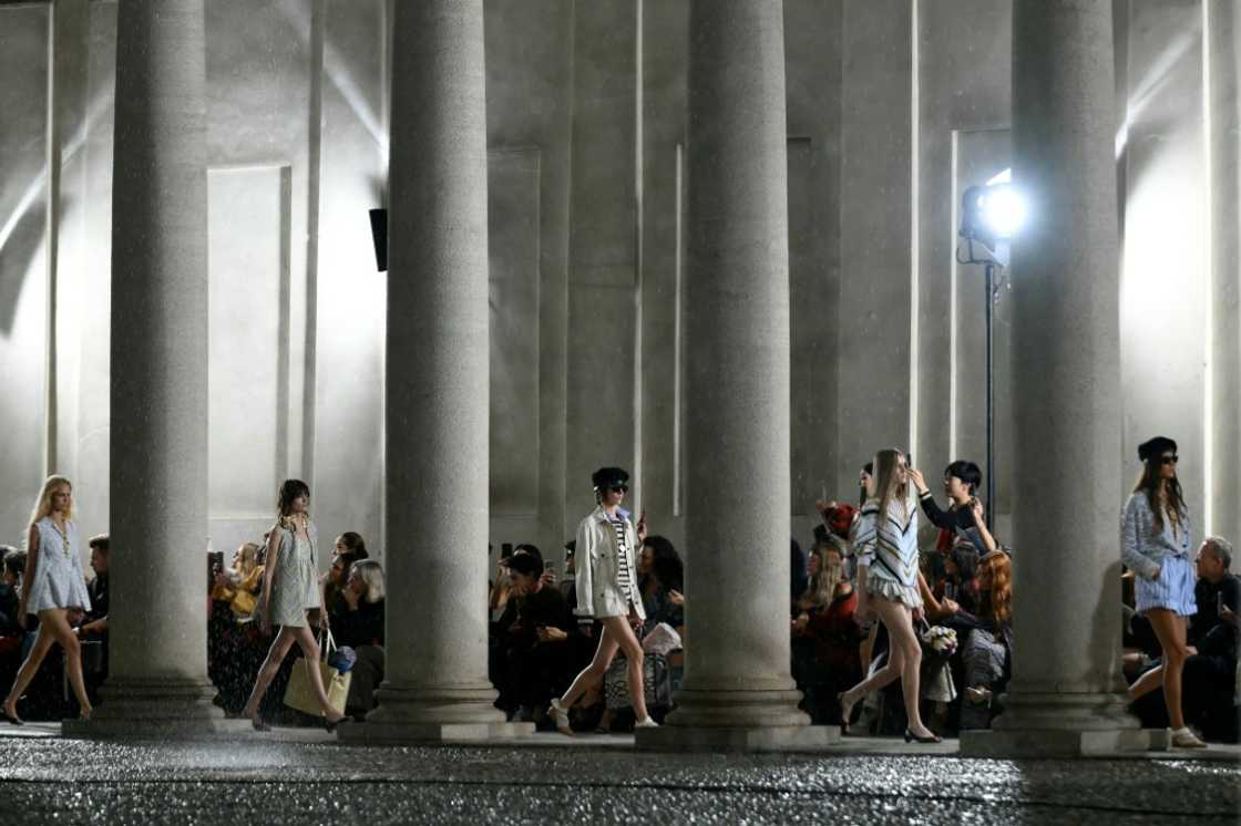 many models wore just swim briefs, shorts were rolled up and mini dresses became open-backed t-shirts.