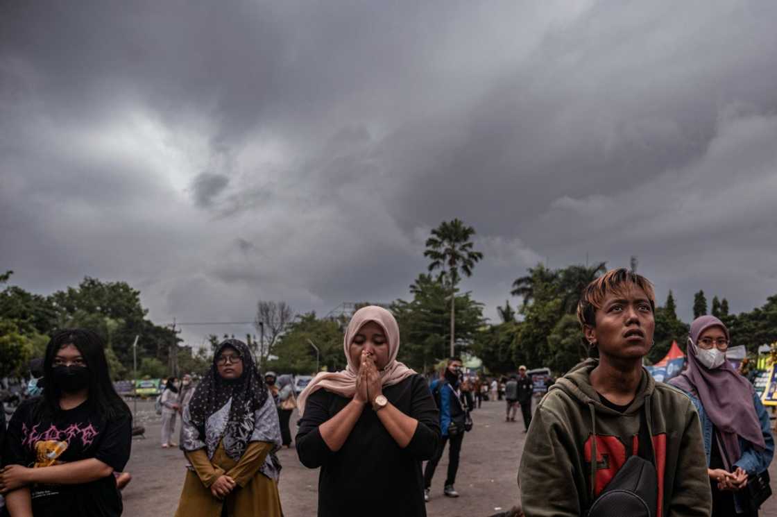 People pay their respects to the victims at Kanjuruhan stadium in Malang after a stampede that killed at least 131 people in one of the deadliest disasters in football history People pay their respects to the victims at Kanjuruhan stadium in Malang after a stampede that killed at least 131 people in one of the deadliest disasters in football history
