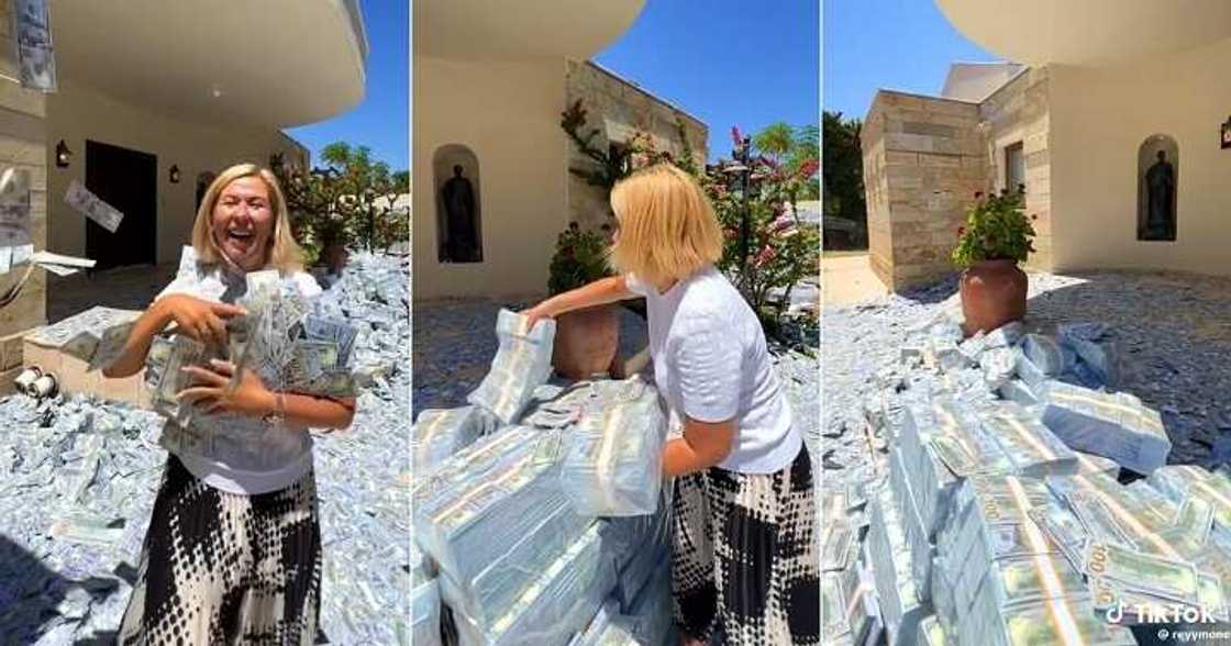 Woman flaunts bundles of cash in her compound