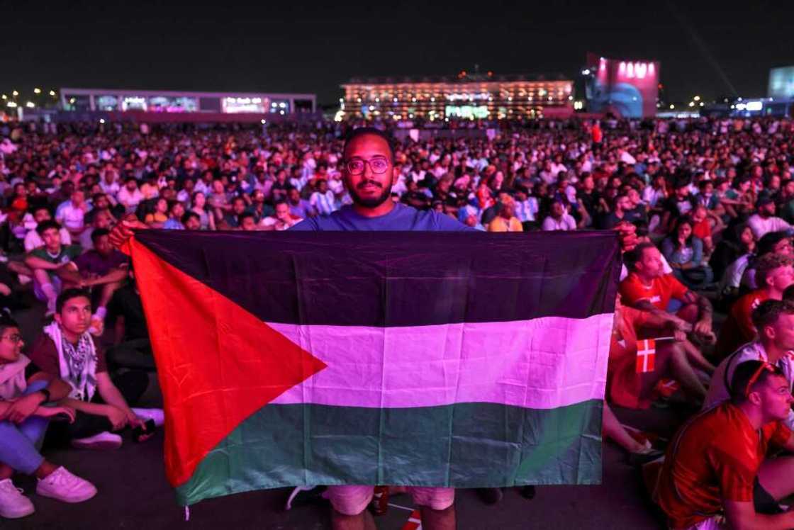 A fan displays a Palestinian flag during the World Cup A fan displays a Palestinian flag during the World Cup