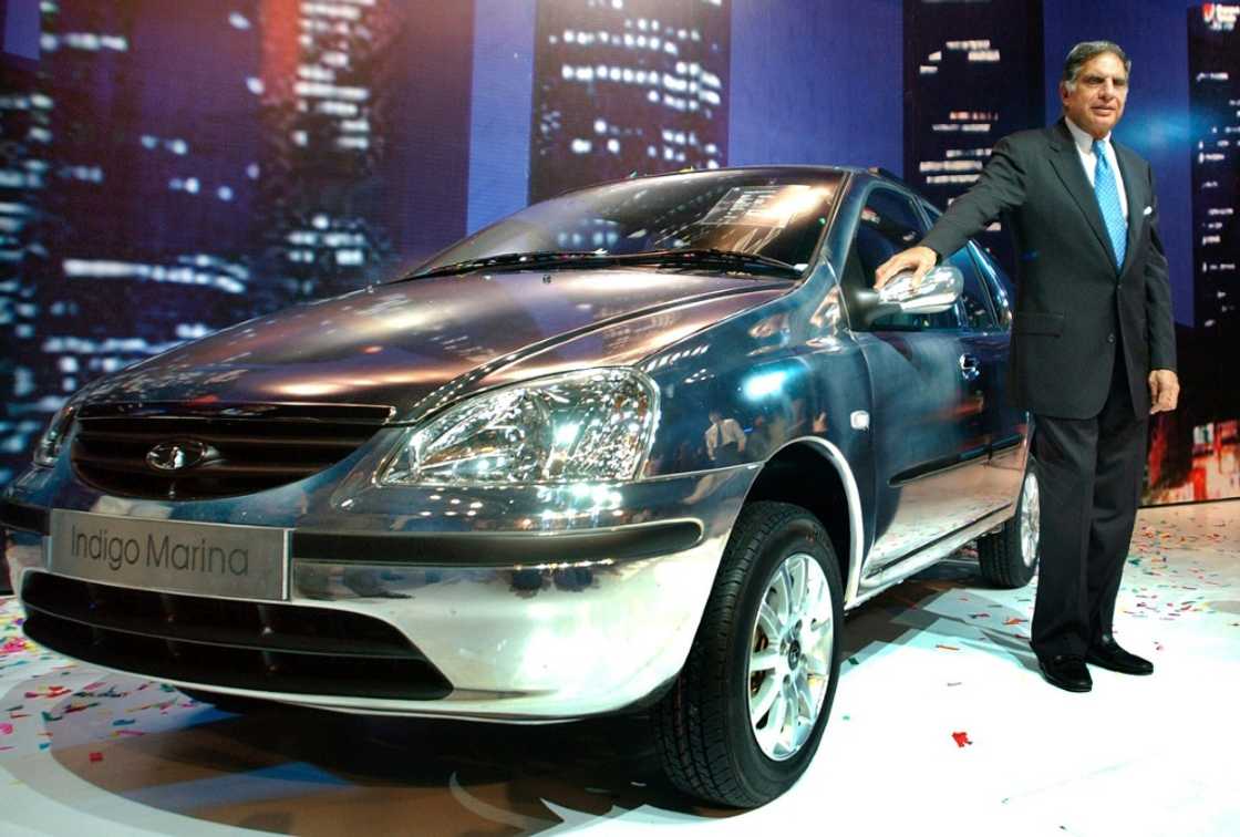 Tata Group Chairman Ratan Tata poses next to a 'Tata Indigo Marina' in 2004 Tata Group Chairman Ratan Tata poses next to a 'Tata Indigo Marina' in 2004