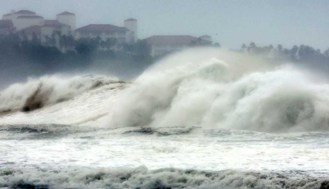 Waves brought by Typhoon Hinnamnor slam into the coast on South Korea's resort island of Jeju