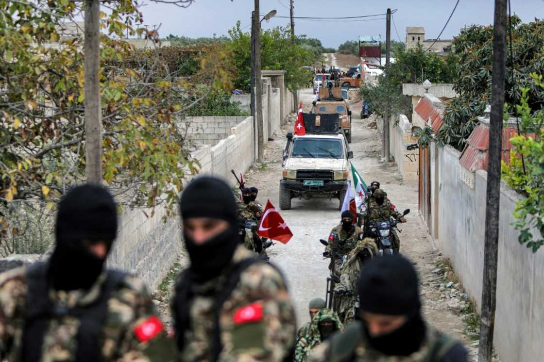 A convoy of Syrian fighters during a military drill by the Turkish-backed 'Suleiman Shah Division' in northern Syria on November 22 A convoy of Syrian fighters during a military drill by the Turkish-backed 'Suleiman Shah Division' in northern Syria on November 22