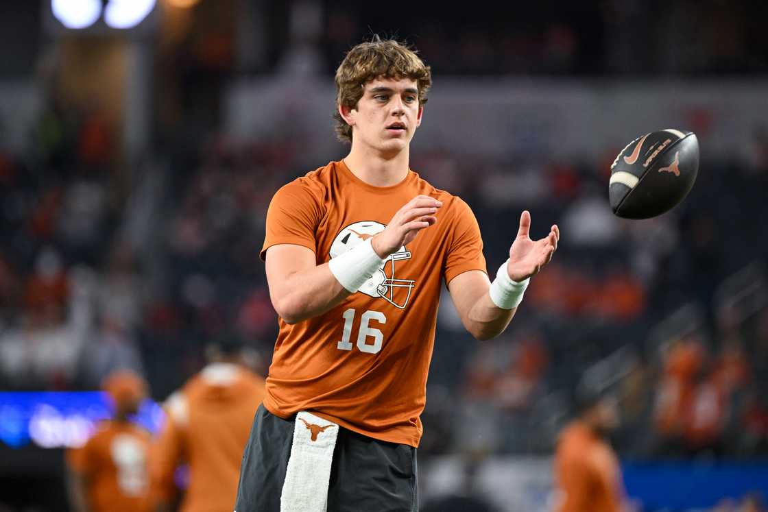Arch Manning of the Texas Longhorns warms up before the Goodyear Cotton Bowl. Arch Manning of the Texas Longhorns warms up before the Goodyear Cotton Bowl.