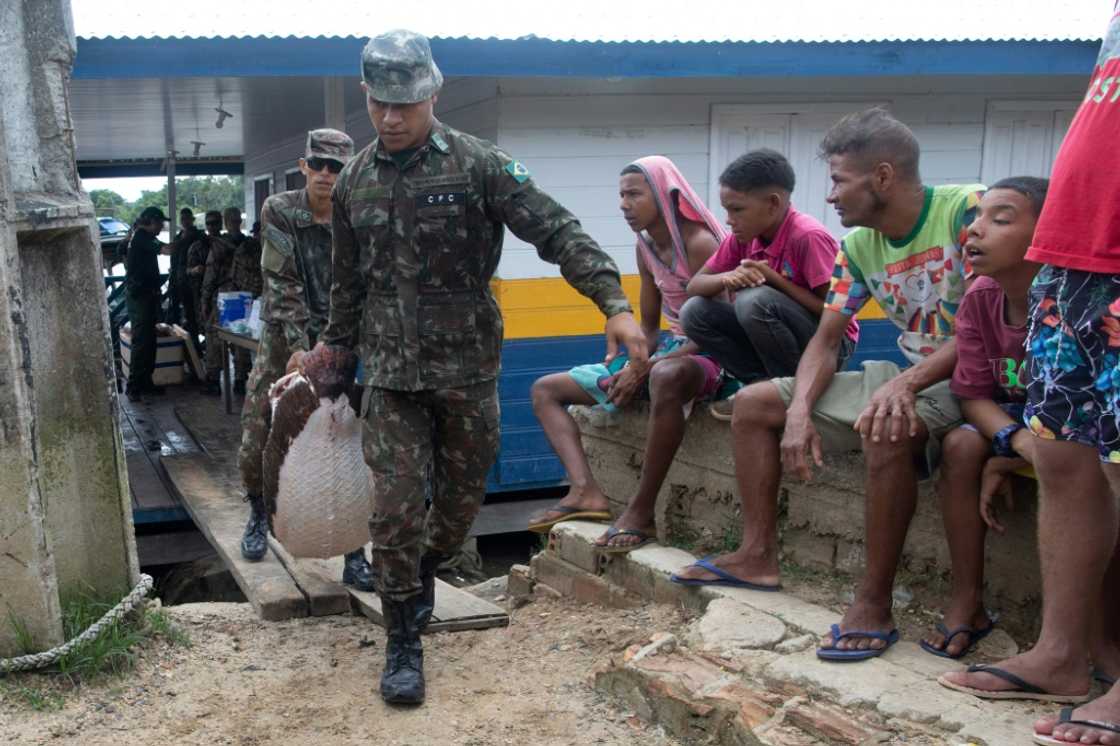 A pirarucu fish is seized after federal police searched a vessel during the investigation into the disappearance of Indigenous expert Bruno Pereira and journalist Dom Phillips in Atalaia do Norte, Brazil on June 11, 2022 A pirarucu fish is seized after federal police searched a vessel during the investigation into the disappearance of Indigenous expert Bruno Pereira and journalist Dom Phillips in Atalaia do Norte, Brazil on June 11, 2022