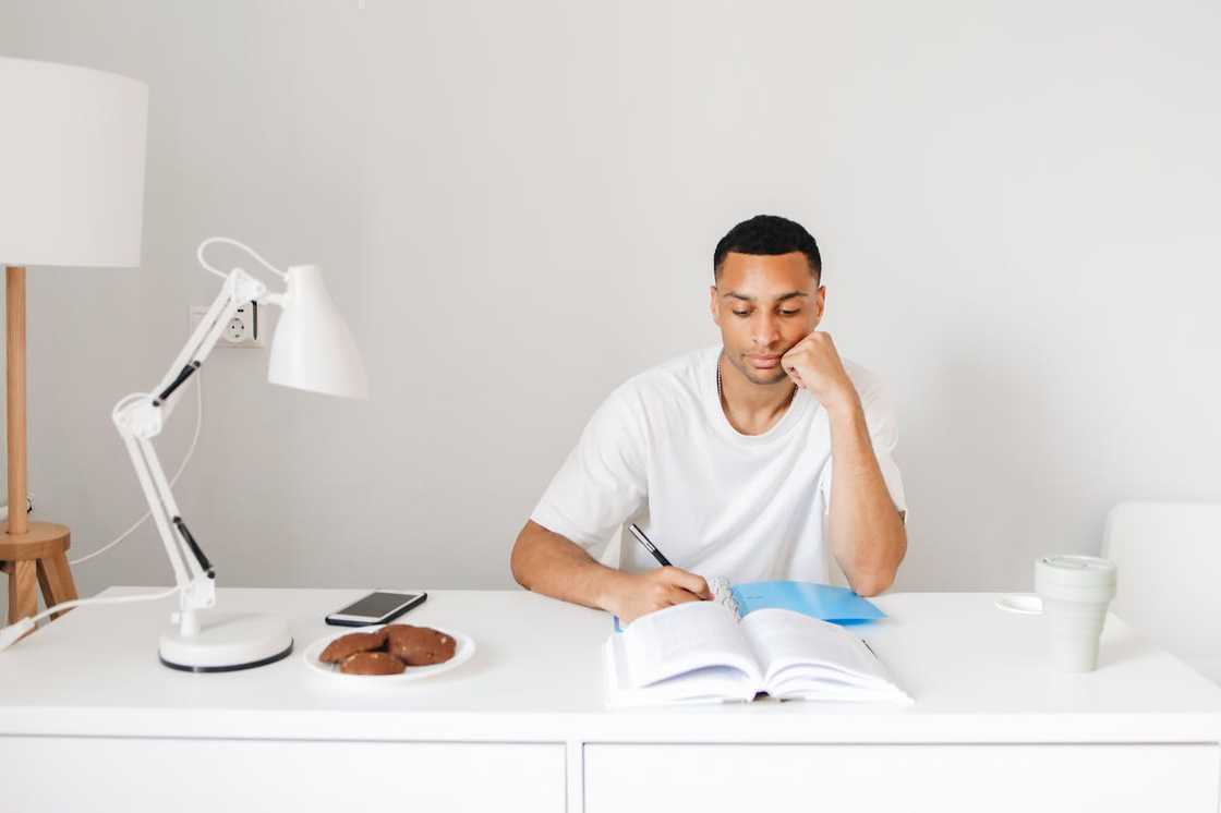 A man researches while studying at home