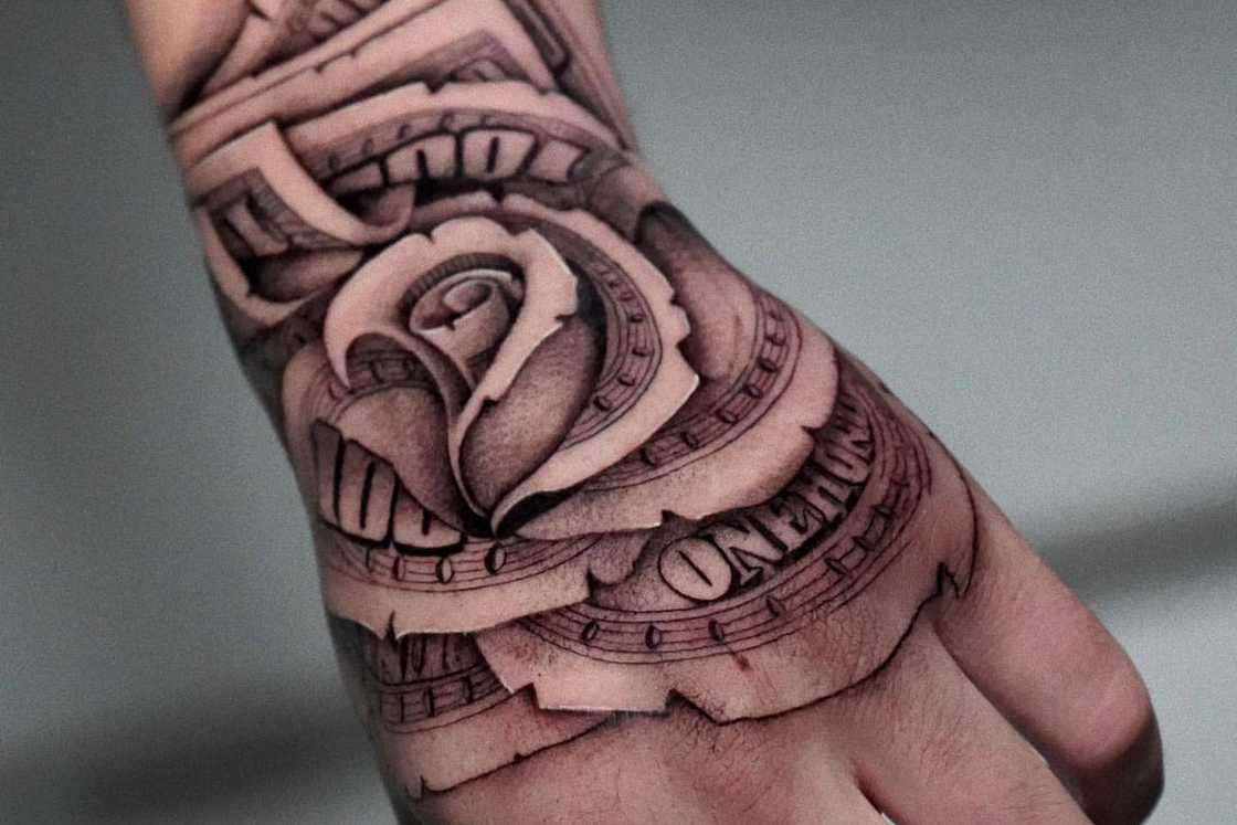A creatively folded money rose hand tattoo A creatively folded money rose hand tattoo