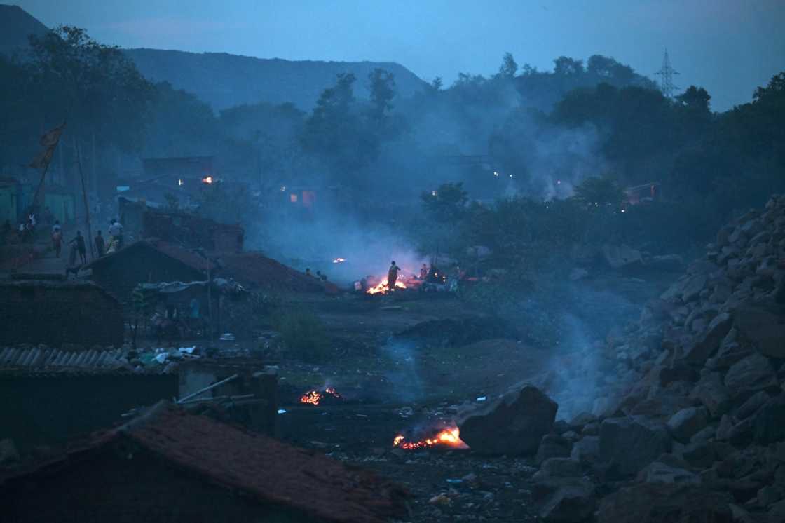 Underground fires in opencast coal mines in eastern India have raged for over a century, creating sinkholes that swallow people and homes Underground fires in opencast coal mines in eastern India have raged for over a century, creating sinkholes that swallow people and homes