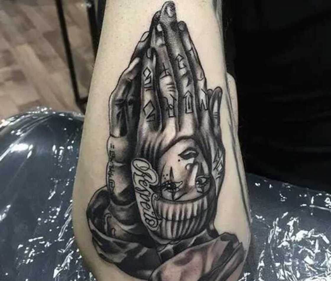 tattoos with praying hands