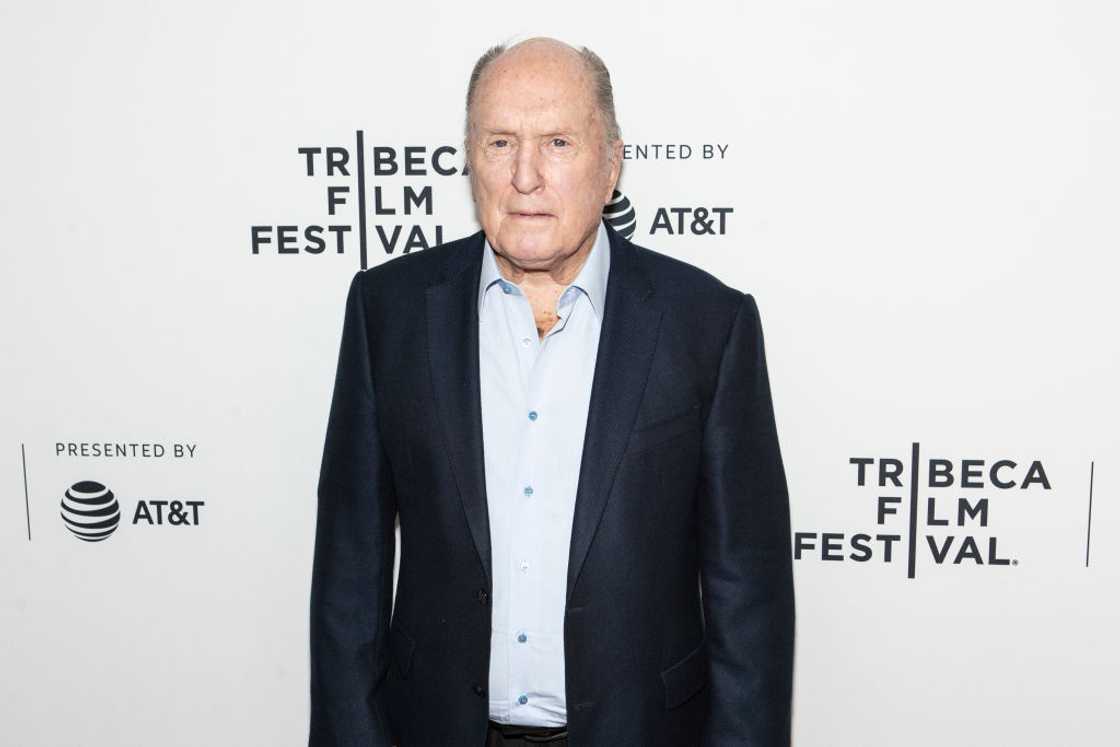 Robert Duvall in a navy blue suit and blue shirt Robert Duvall in a navy blue suit and blue shirt
