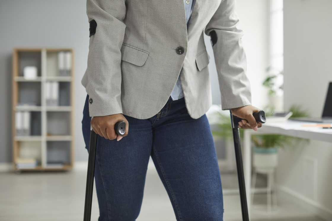 A woman with crutches