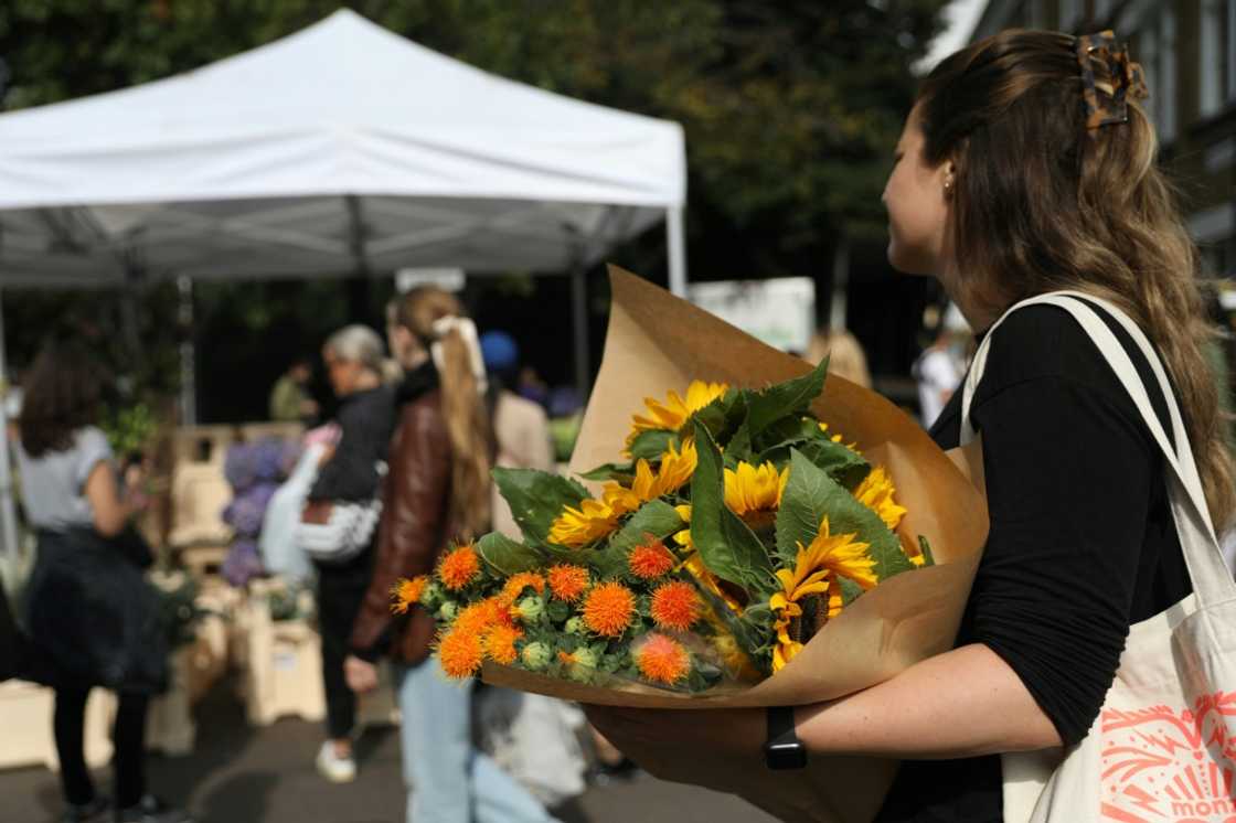 Flowers like roses, chrysanthemums, lilies and sunflowers have been popular choices for tributes