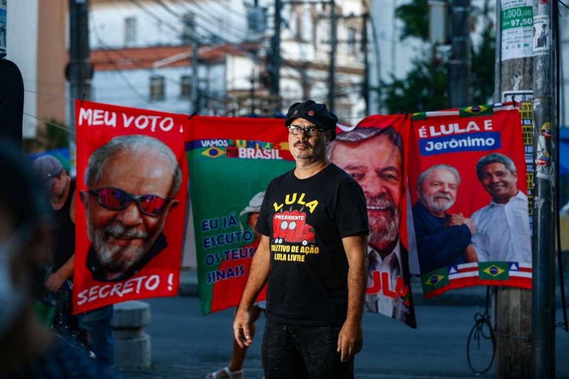 Messias Figueiredo, 56, is a well-known figure at left-wing protests -- instantly recognizable with his rectangular glasses and an ever-present red boom box emblazoned with Brazilian former president Luiz Inacio Lula da Silva's picture Messias Figueiredo, 56, is a well-known figure at left-wing protests -- instantly recognizable with his rectangular glasses and an ever-present red boom box emblazoned with Brazilian former president Luiz Inacio Lula da Silva's picture