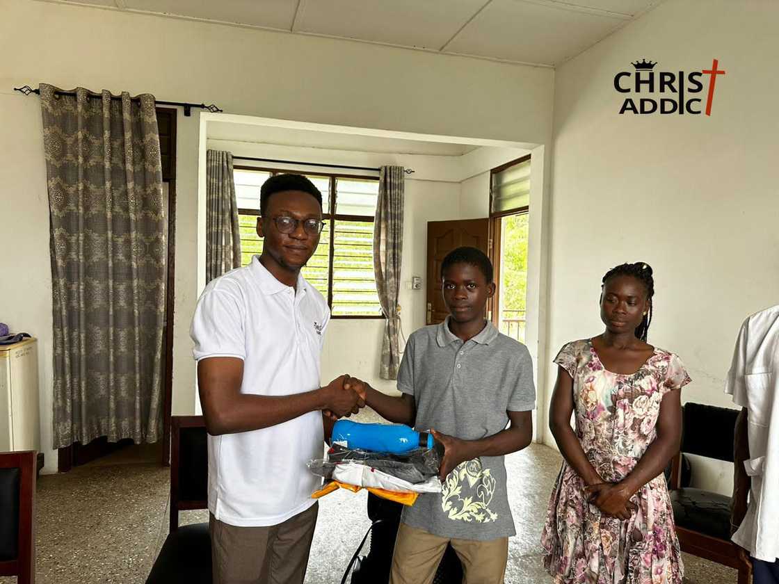 Photo as Ghanaian orphan receives help from charity.