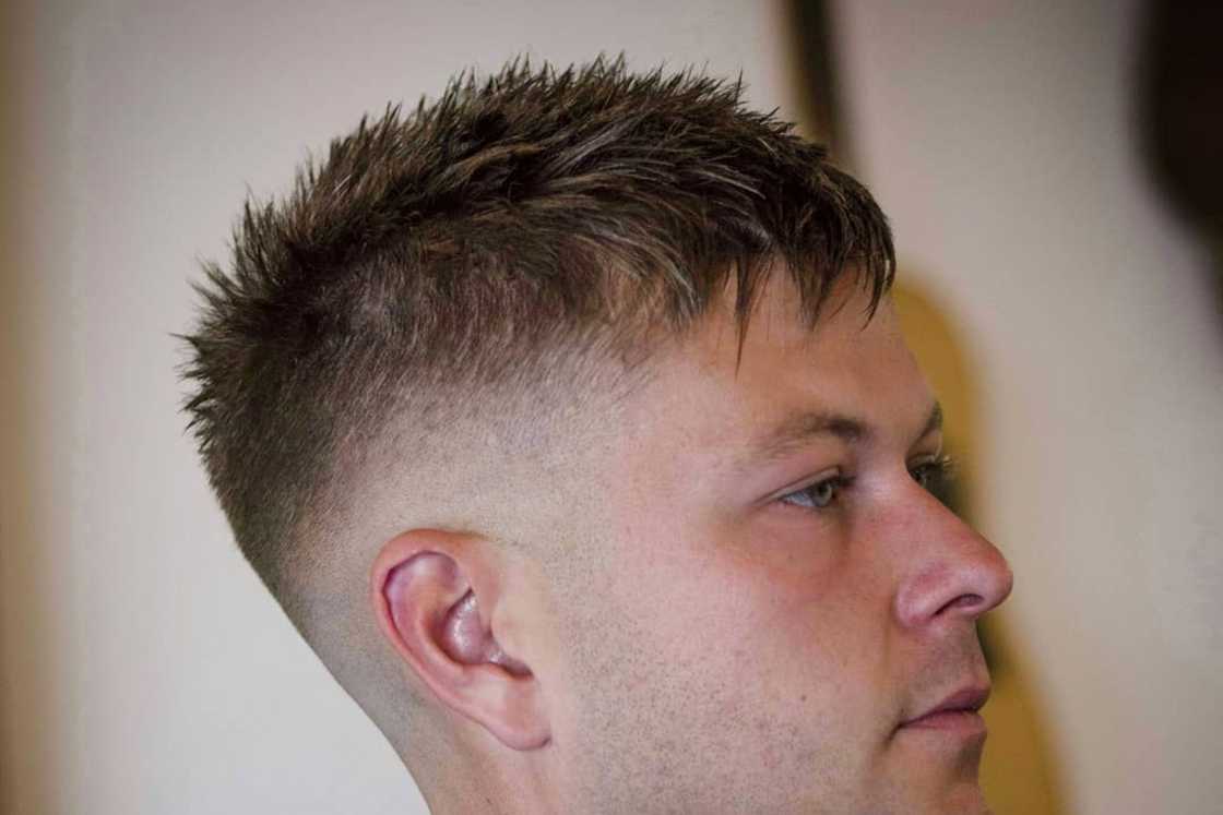 A white man with short and messy hairstyle A white man with short and messy hairstyle