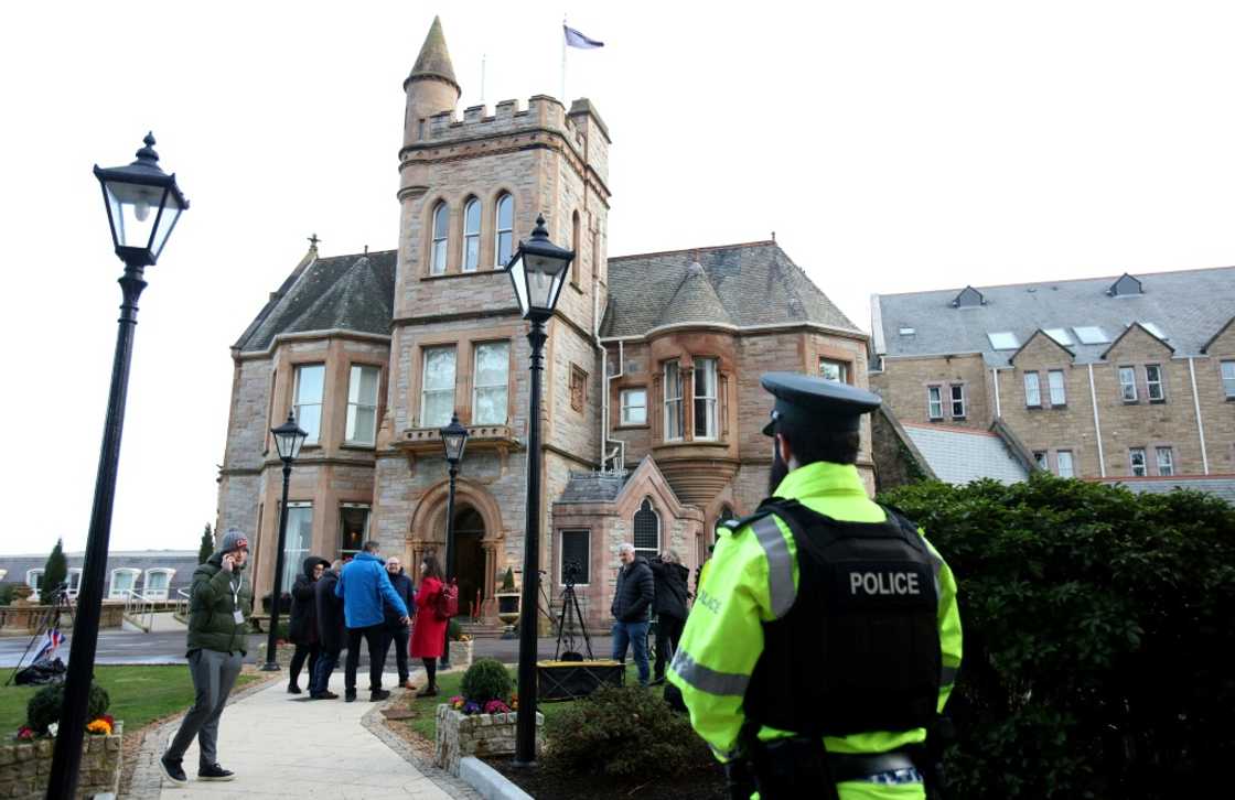Journalists gather outside the Culloden Hotel near Belfast Journalists gather outside the Culloden Hotel near Belfast