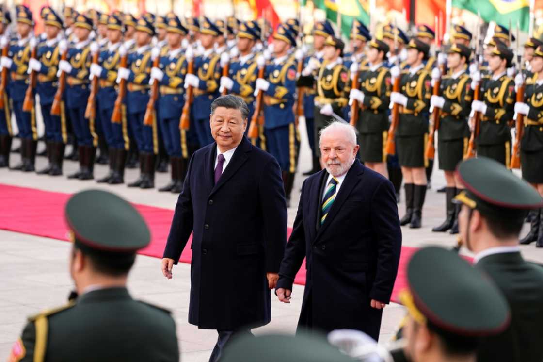 Chinese President Xi Jinping (L) and Brazil's President Luiz Inacio Lula da Silva have called on developed countries to honour their climate pledges Chinese President Xi Jinping (L) and Brazil's President Luiz Inacio Lula da Silva have called on developed countries to honour their climate pledges