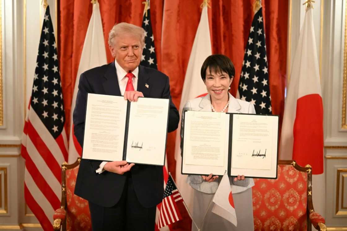 Japan's Prime Minister Sanae Takaichi (R) and US President Donald Trump attend a signing ceremony after a Japan-US Summit at the Akasaka State Guest House in Tokyo on October 28, 2025. Japan's Prime Minister Sanae Takaichi (R) and US President Donald Trump attend a signing ceremony after a Japan-US Summit at the Akasaka State Guest House in Tokyo on October 28, 2025.