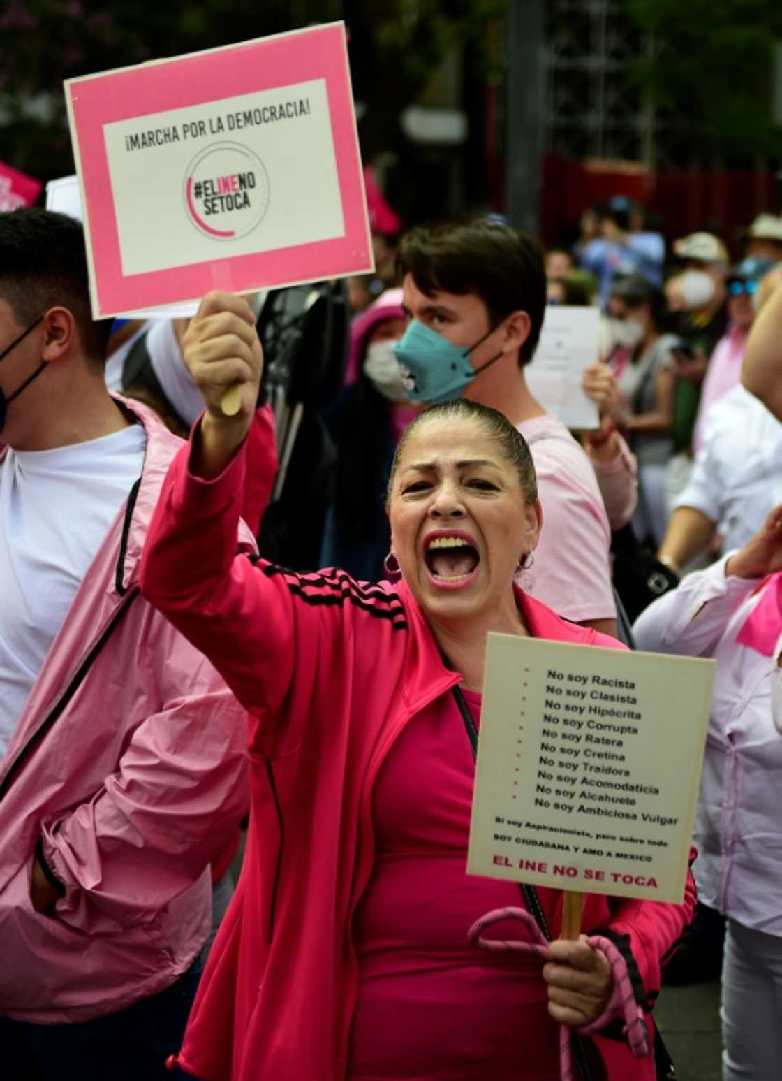 A woman shouts slogans during a march against government plans to restructure the National Electoral Institute in Mexico City on November 13, 2022 A woman shouts slogans during a march against government plans to restructure the National Electoral Institute in Mexico City on November 13, 2022