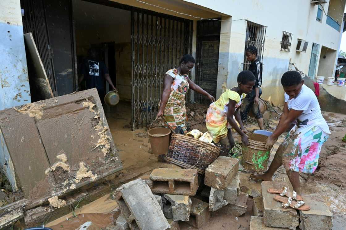 In Bingerville, residents cleared out their homes after the water finally receded In Bingerville, residents cleared out their homes after the water finally receded