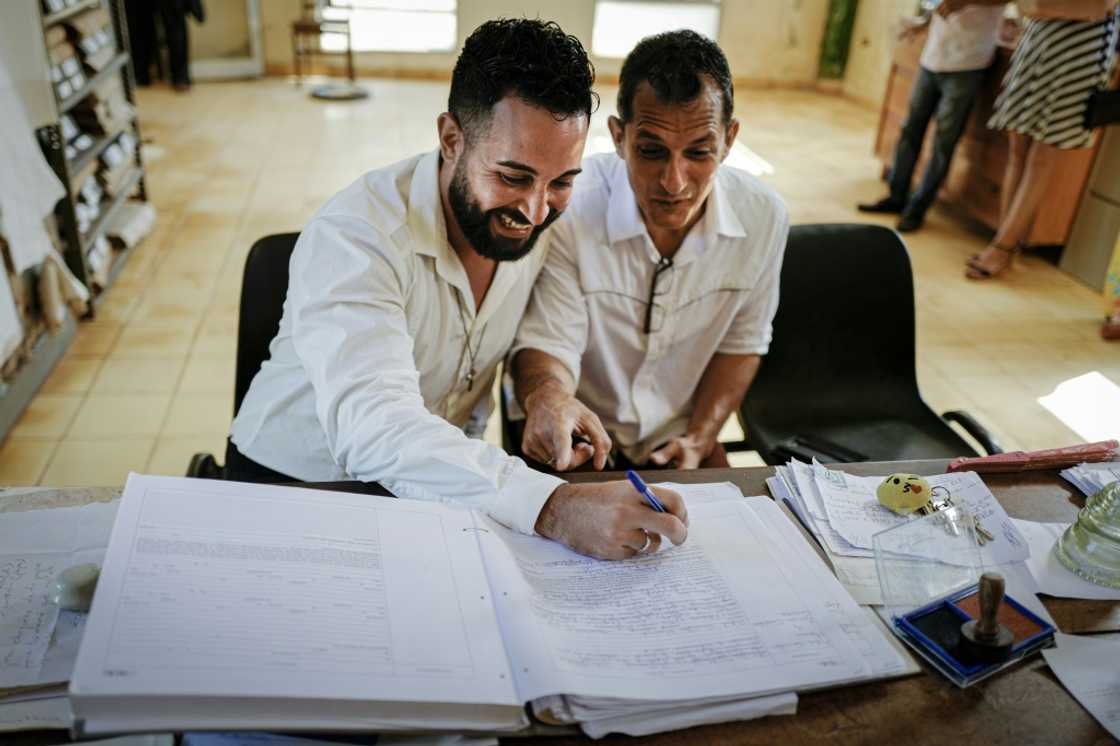 Lazaro Gonzalez (R) and Adiel Gonzalez were among the first to legally tie the knot in Cuba Lazaro Gonzalez (R) and Adiel Gonzalez were among the first to legally tie the knot in Cuba