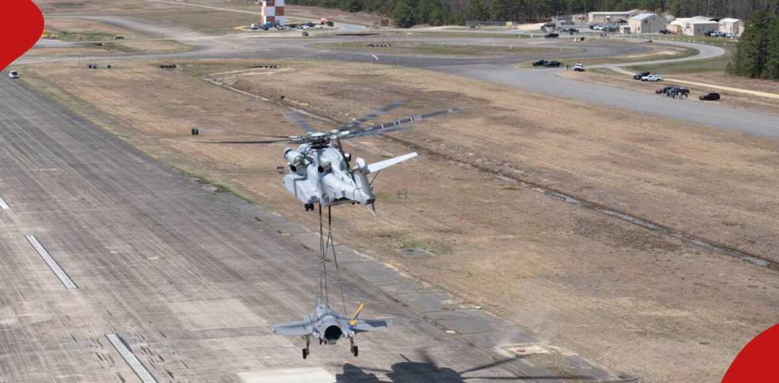 Helicopter refueling military jet mid-air Helicopter refueling military jet mid-air