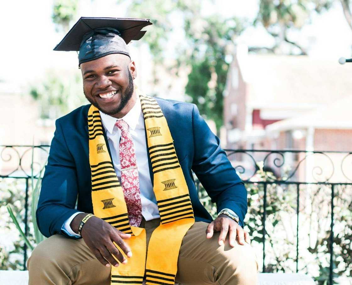 A happy graduate reflecting on his life A happy graduate reflecting on his life