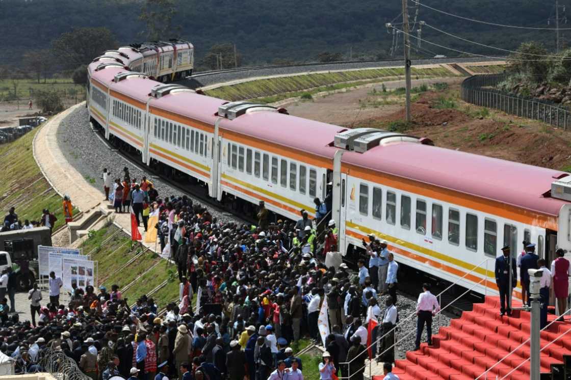 Passengers disembark from the Standard Gauge Railway in Kenya, which was constructed by the Chinese Communications Construction Company and financed by Chinese government Passengers disembark from the Standard Gauge Railway in Kenya, which was constructed by the Chinese Communications Construction Company and financed by Chinese government