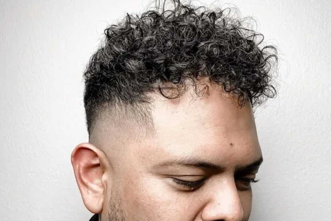 Curly hair undercut with mohawk fade Curly hair undercut with mohawk fade