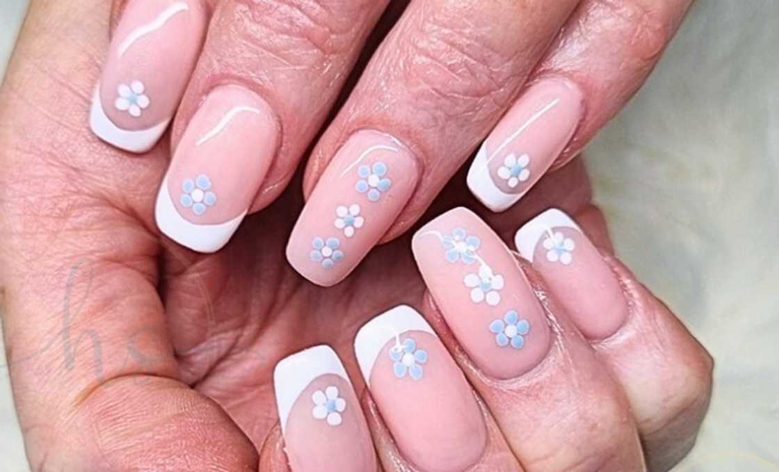 Milky nails with colorful flowers