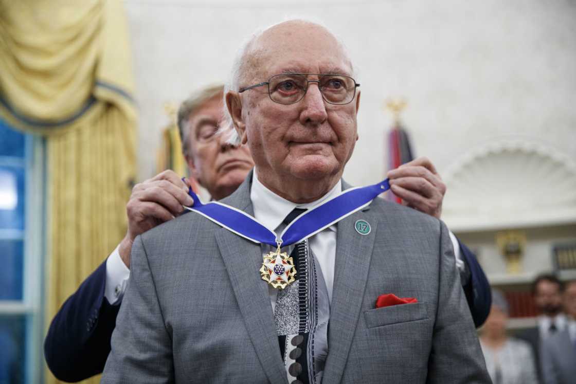 Bob Cousy receiving a medal