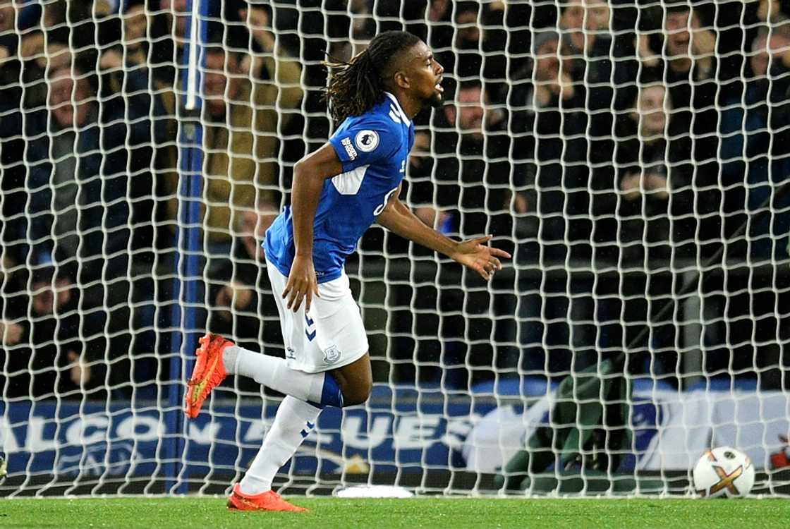 Alex Iwobi celebrates scoring for Everton against Manchester United at Goodison Park.