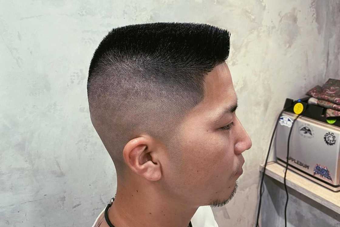 An Asian man with a flat top haircut An Asian man with a flat top haircut