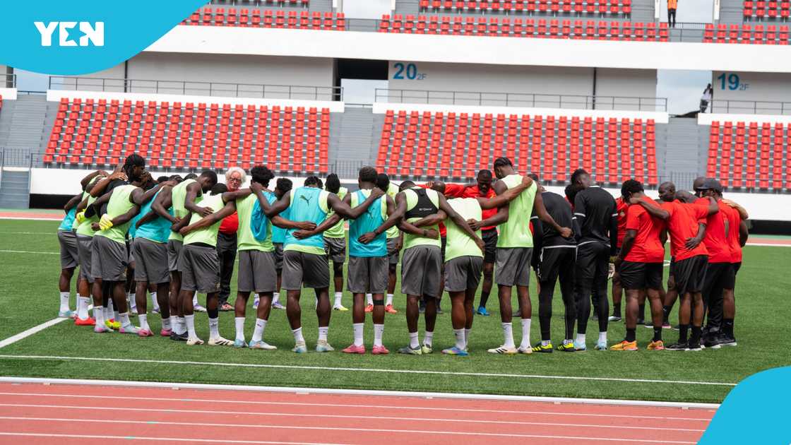 Players and the technical staff of the Black Stars form a huddle after their final training session in N'Djamena. Photo credit: @GhanaBlackstars/X.