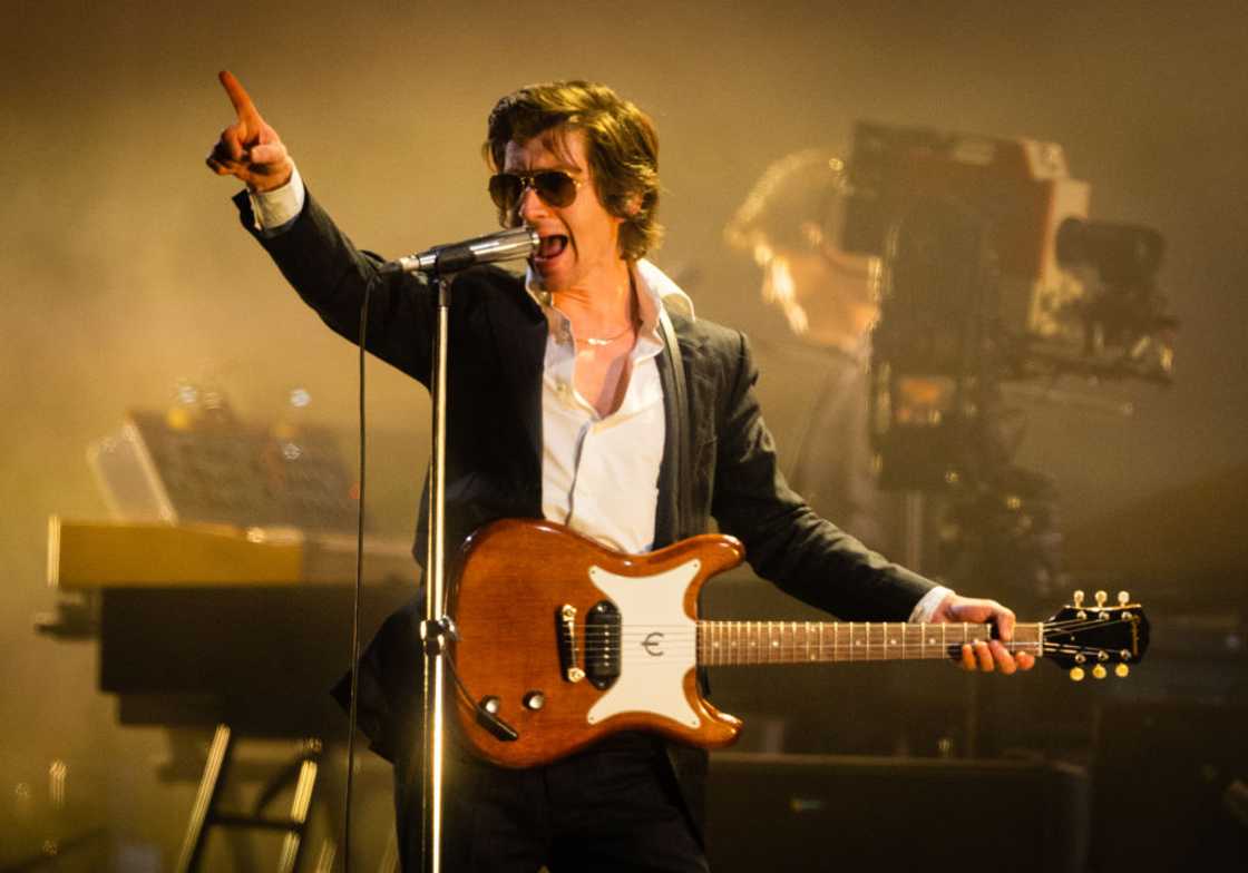Alex Turner of Arctic Monkeys performing live on stage Alex Turner of Arctic Monkeys performing live on stage