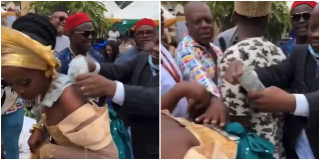 Man picks money from bride on the dancefloor Man picks money from bride on the dancefloor